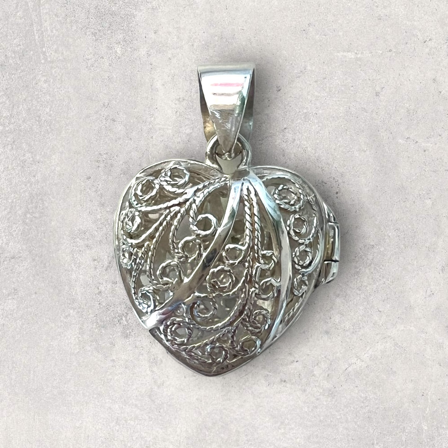 Silver filigree opening heart pendant