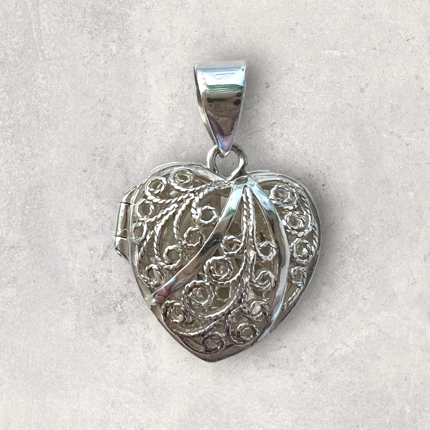 Silver filigree opening heart pendant