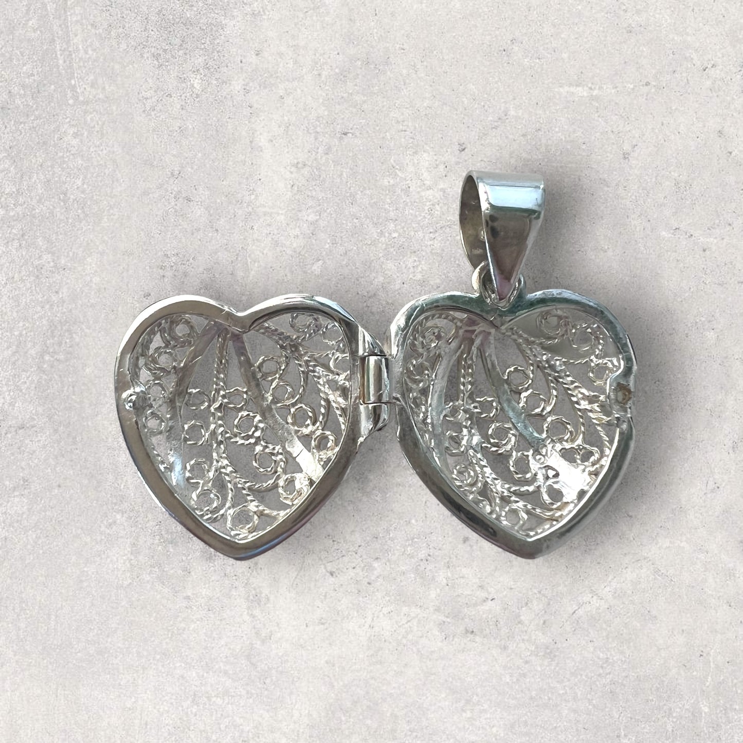 Silver filigree opening heart pendant